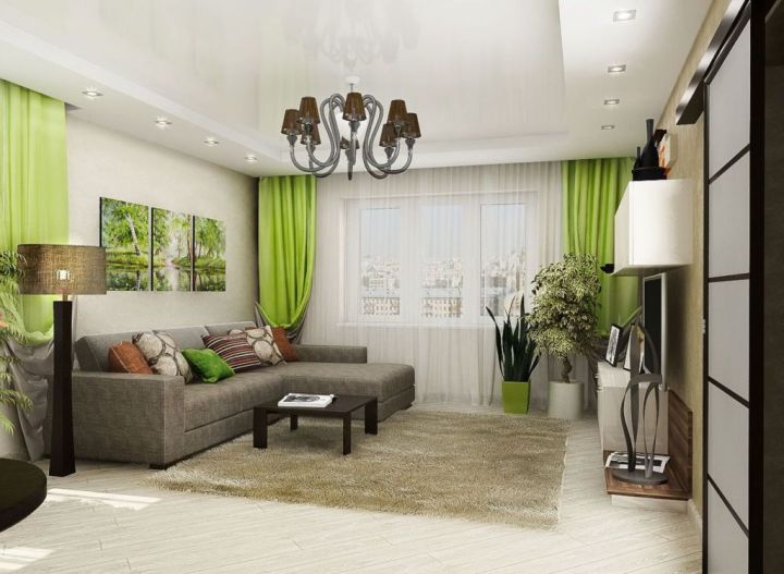 Серый диван в сочетании с зеленым текстилем и бежевыми стенами